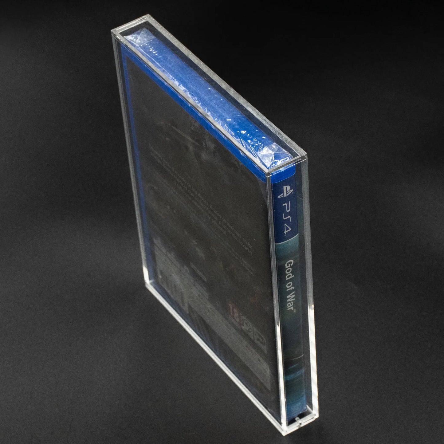Vista lateral de caja de metacrilato con cierre imantado para ps4