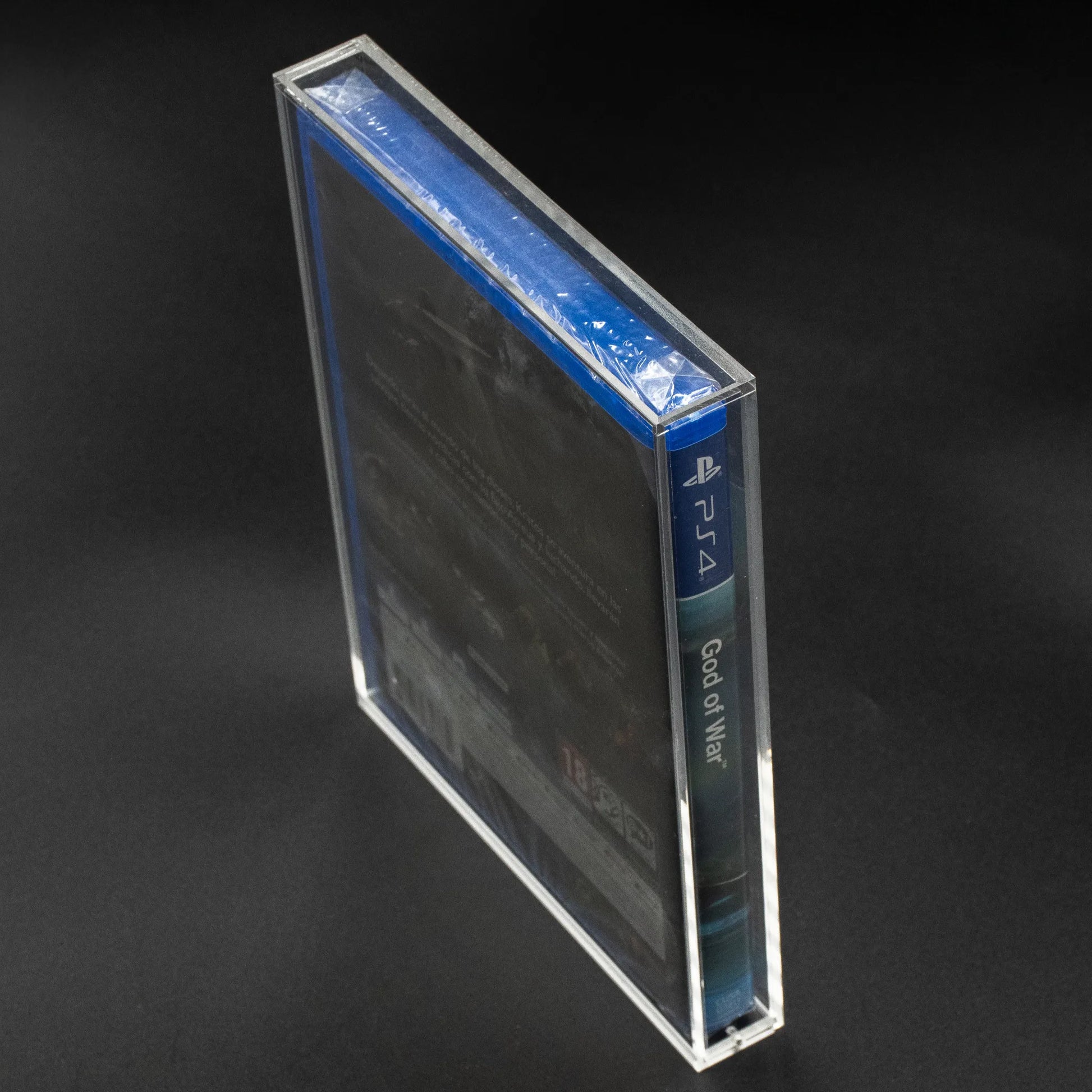 Vista lateral de caja de metacrilato con cierre imantado para ps4