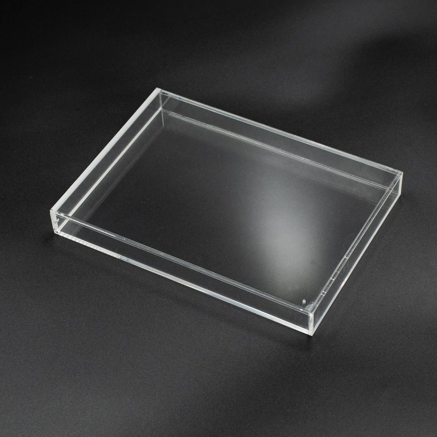 Vista superior de caja de metacrilato para videojuego de Nintendo Wii con cierre imantado y ventilación